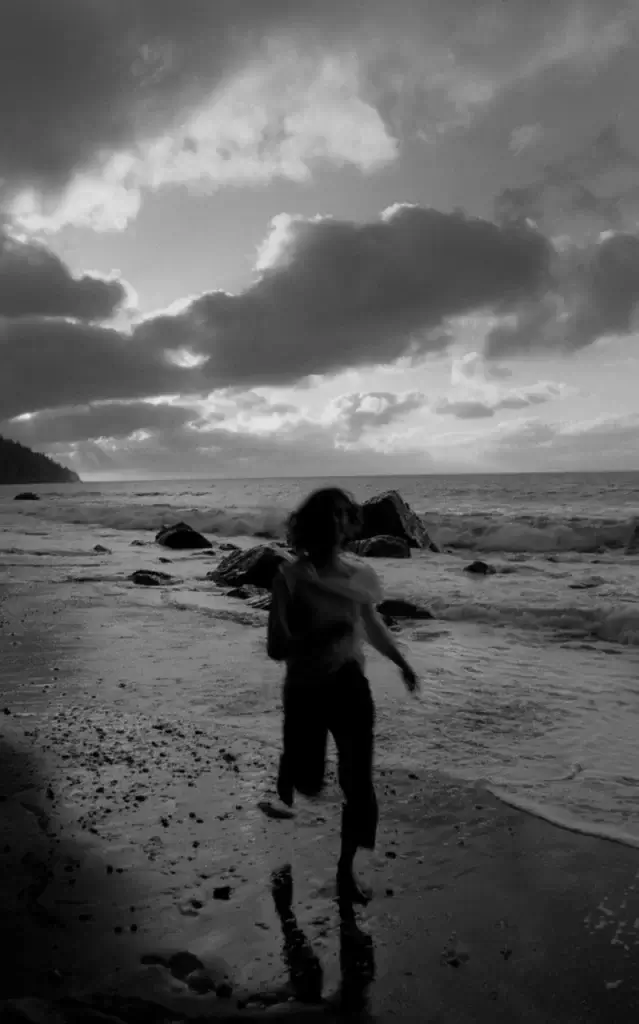 aesthetic mm running man blurry beach vancouver bw film photo